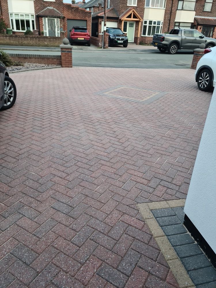 Block-paved driveway cleaned in front of a house