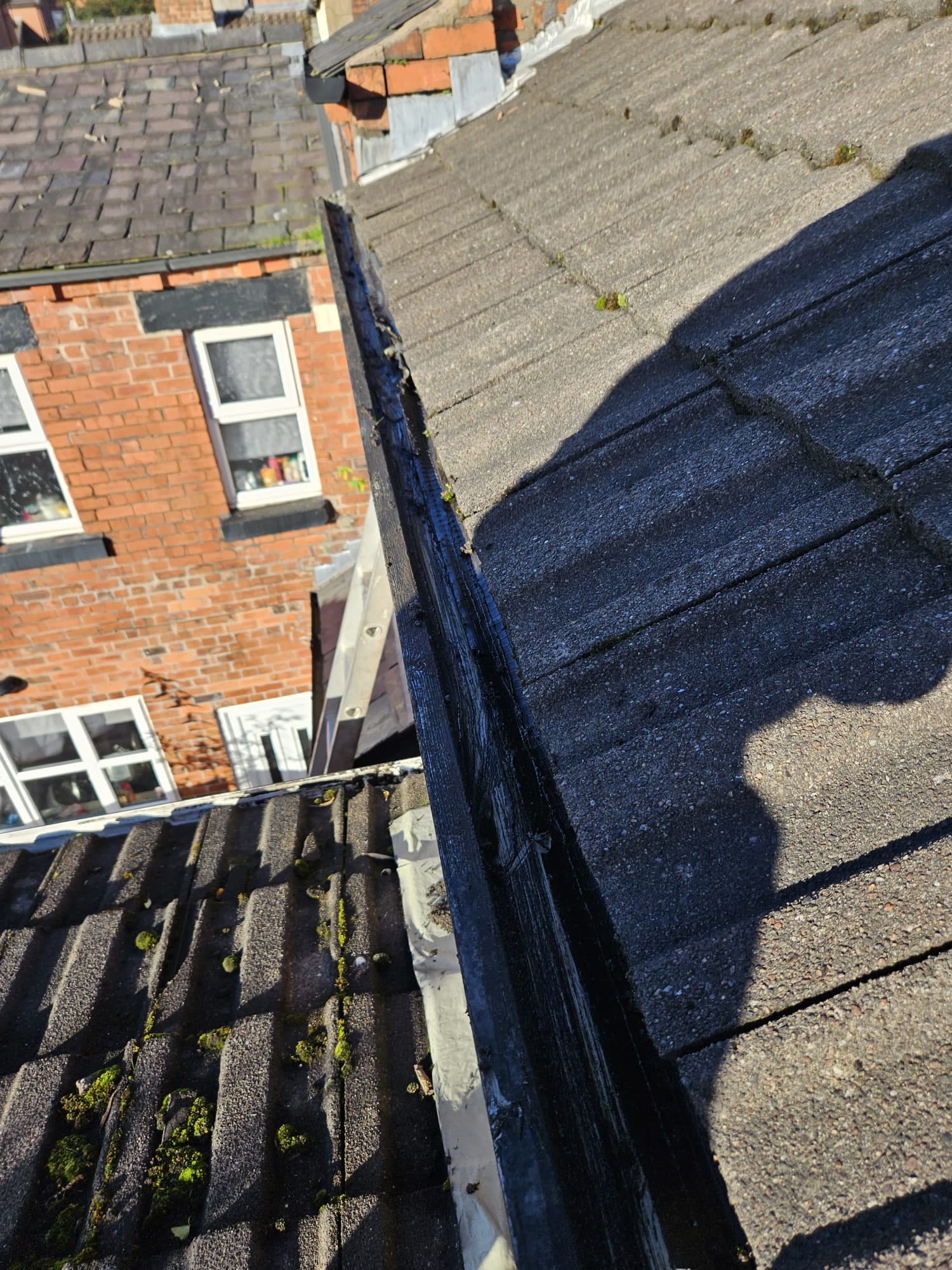 The same gutter cleared out and clean after the job