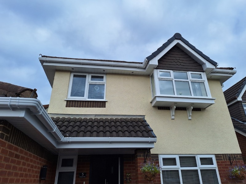 A render-fronted detached home in the St Helens area after a full exterior clean